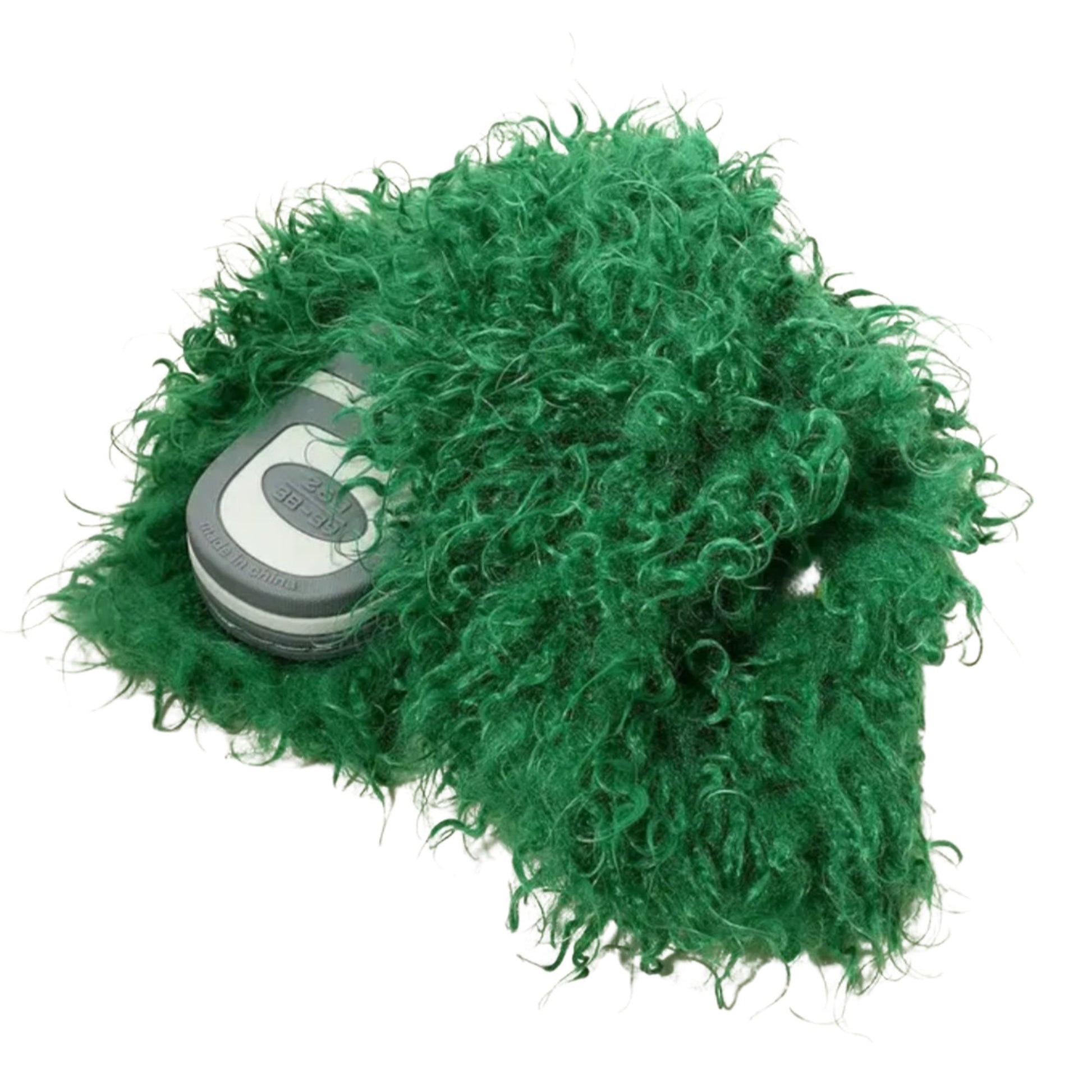 Green fluffy dog toy with a phone inside on a white background