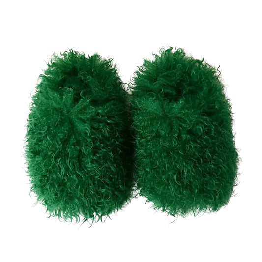 Pair of green fuzzy slippers on a white background