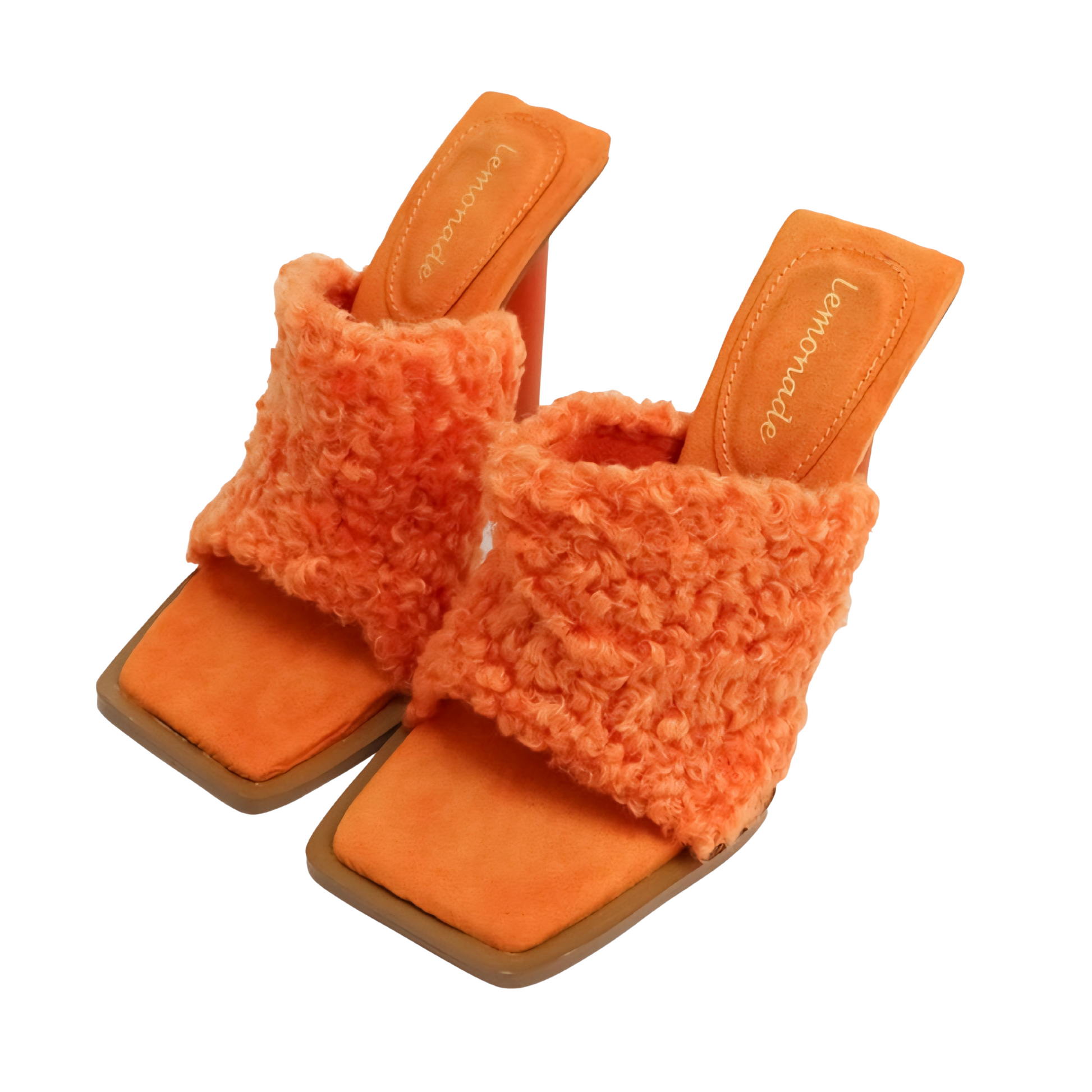 Orange fuzzy sandals on a white background